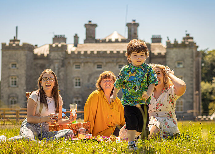 family having an picnic with slane Castle in the backround