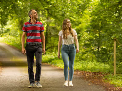 Couple walking through Slane Castle grounds