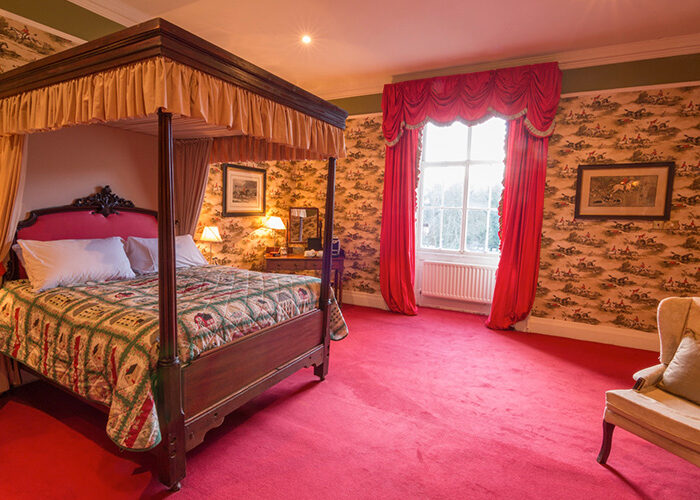 Four poster bed with large window