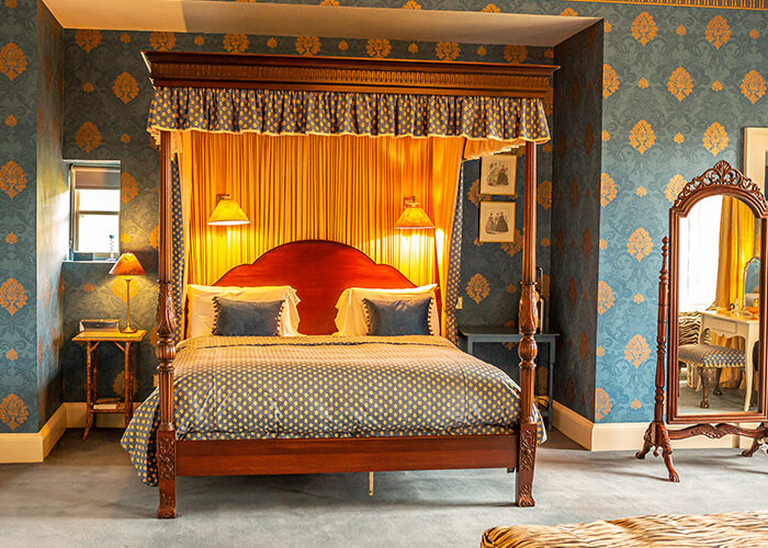 A four poster bed in the Kings Room