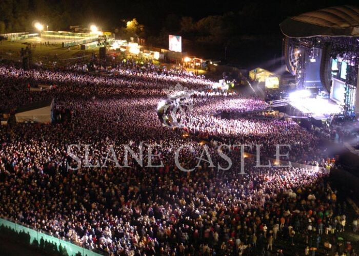An evening image of crowd and stage at Slane Castle