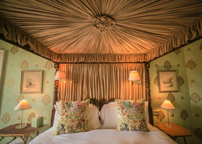 Inside of a four poster bed showing fabric