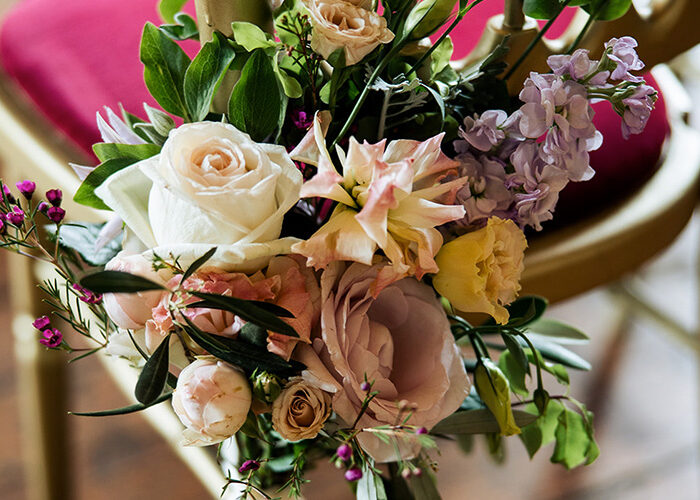 Fesh flowers tied to antique chair