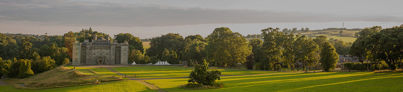 Slane Castle in sunshine with green fields
