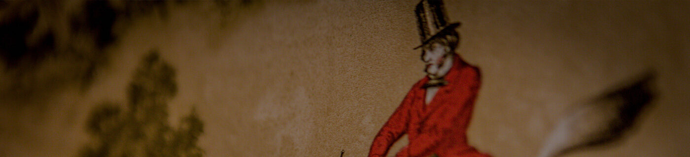 A section of wallpaper showing a man on a horse