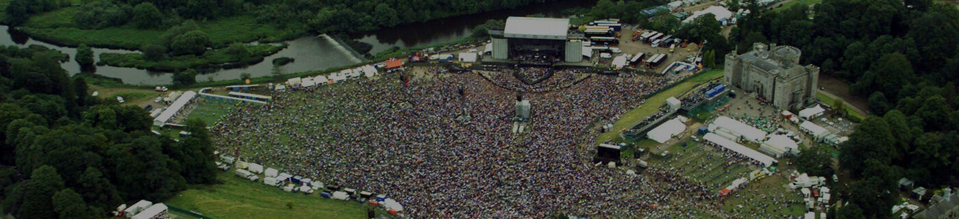 An aerial view of a concert showing stage and crowd