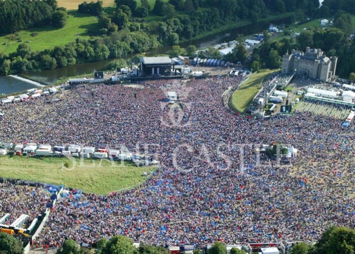 An aerial view of a concert at Slane showing stage and Castle