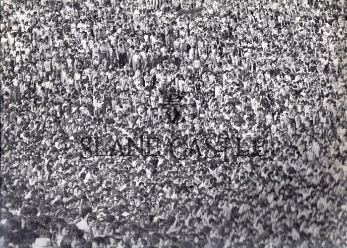A black and white image of a crowd of people at Slane