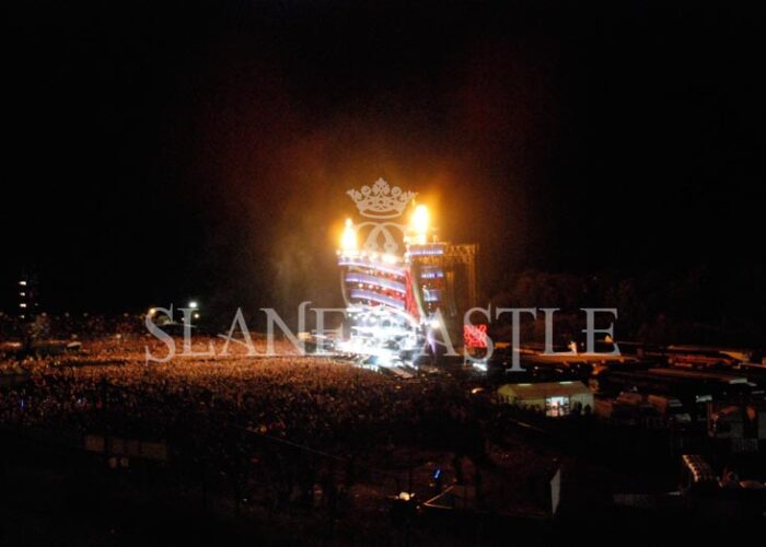 Night time concert with fireworks and crowd