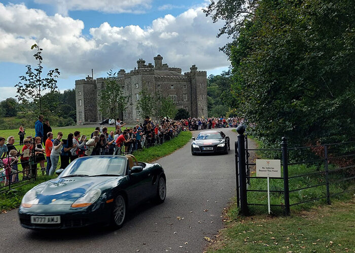Cars driving through Slane Castle for Cannonball event